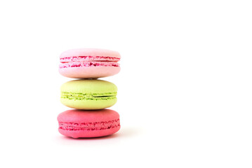 Colorful macarons on white background.