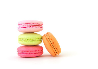 Colorful macarons on white background.