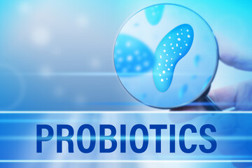 The concept of probiotics in blue. The word probiotics and beneficial bacteria under the...