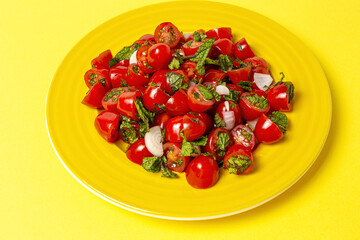 Homemade cherry tomato salad with fresh onions, mint, olive oil and salt