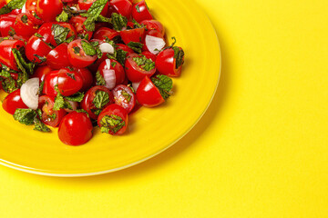 Homemade cherry tomato salad with fresh onions, mint, olive oil and salt