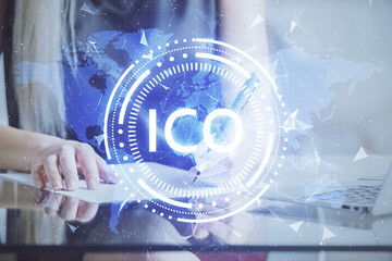 Cryptocurrency hologram over woman's hands writing background. Concept of blockchain. Multi exposure