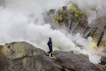 People mining sulphur in Ijen volcano, Java , Indonesia