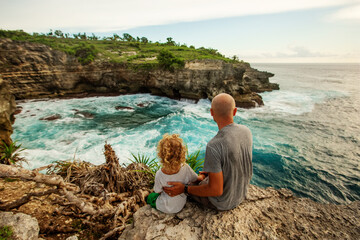 Father with son by the ocean