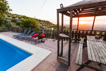 Exterior terrace of a rural rental house with pool in Spain.