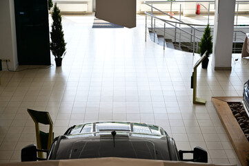 Photo of the interior with cars inside the building.