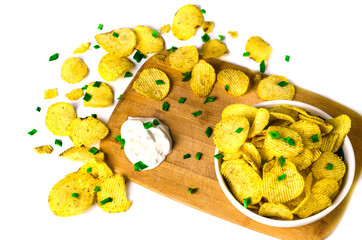 chips on a white background with green onions