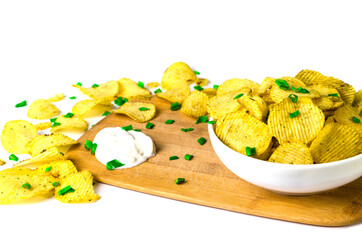 chips on a white background with green onions