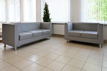 Photo of a sofa for relaxing in the interior inside the building.