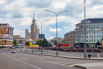 Fototapeta na wymiar Moscow. Russia. Highway in the center of Moscow. Russian architecture. Empty road. Road architecture of Moscow. Cityscape Russian city. The capital of Russia on a summer day. Tourism in Russia