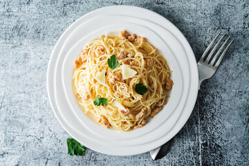 Ground chicken or turkey pasta in a white plate