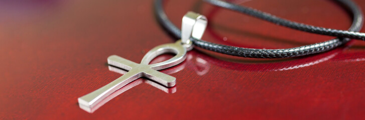 Egyptian amulet ankh on a blue background, .Egyptian cross