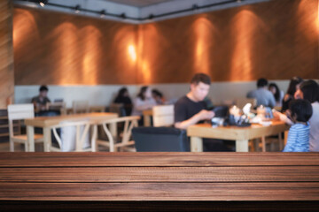 Empty wooden table space platform and blurred restaurant or coffee shop background for product display montage