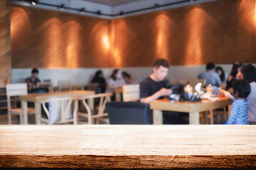 Empty wooden table space platform and blurred restaurant or coffee shop background for product display montage