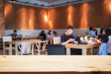 Empty wooden table space platform and blurred restaurant or coffee shop background for product display montage