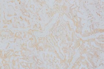 Dolomite texture. Natural rock with beautiful beige patterns on the surface. Polished flat stone. Classic luxury decoration building material. Solid stone background.