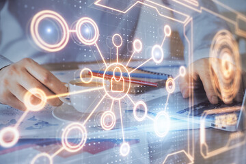 Media network theme hologram with man working on computer on background. Concept of internet...