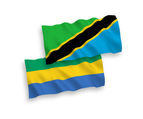 Flags of Gabon and Tanzania on a white background