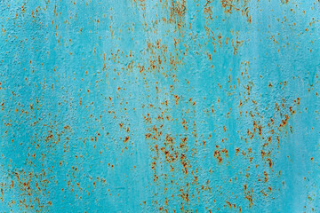 Rusty surface of a turquoise sheet of iron. Background. Space for text.