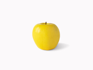 Isolated yellow beautiful apple on a white background.