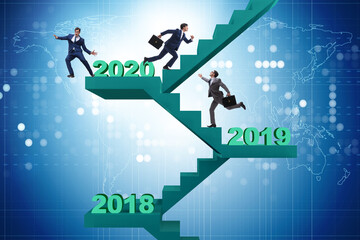 Businessman climbing stairs on yearly basis
