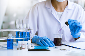 scientists researching in laboratory in white lab coat