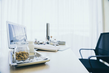 Medicine pill on table in doctor working room at hospital , Health care and medical concept wiht copy space