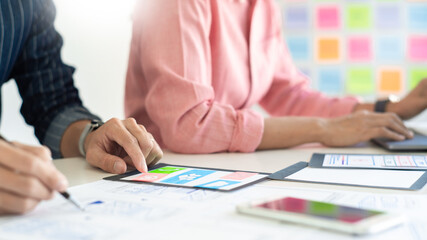 Team designer creative graphic planning or designing prototype for mobile phone 