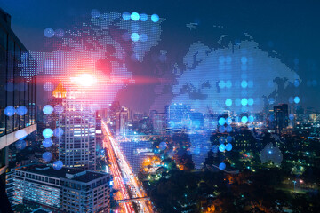 Hologram of Earth planet map on night panoramic cityscape of Bangkok, Asia. The concept of international companies. Multi Exposure.