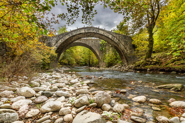 The stone bridge of Vigla or Balkan, between the villages of Votonosi and Anthohori, near Metsovo, in Ioannina prefecture, Epirus region, Greece.