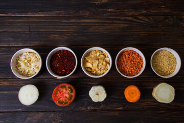 Bowls with dried and ground vegetables. Top view