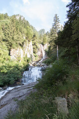 Fototapeta na wymiar Mountain waterfall Salt de Rebet in forest, Braone Valley, Italy.