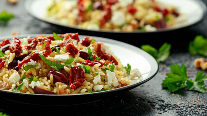 Orzo Pasta with sunshine dry tomato, black olives, walnut and feta cheese
