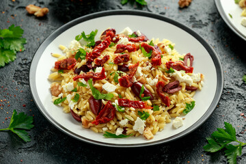 Orzo Pasta with sunshine dry tomato, black olives, walnut and feta cheese