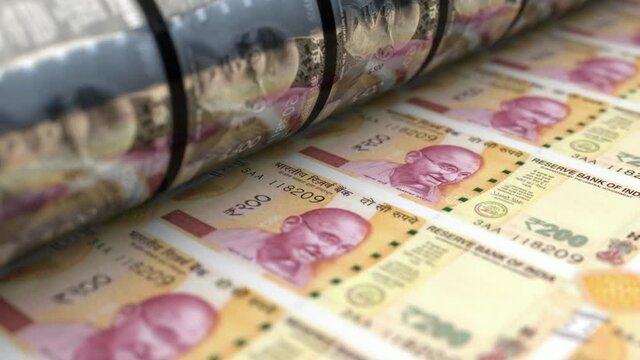 A loop able animation concept image showing a long sheet of new indian rupee notes going through a print roller in its final phase of a print run	