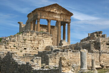 Fototapeta na wymiar The remains and ruins of the Roman city of Dougga with the Capitol in Tunisia. 