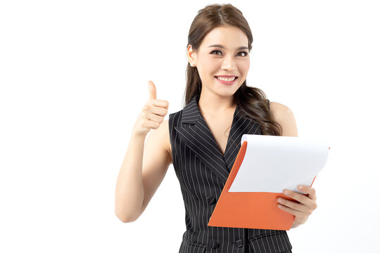 Portrait happy beautiful young asian business woman long hair standing and holding clipboard and holding their thumb up with smile over white background. With copy space for your text.