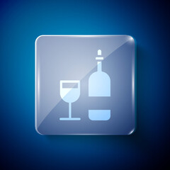 White Wine bottle with glass icon isolated on blue background. Square glass panels. Vector Illustration
