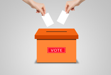 Voting Concept : Many hands holding white blank paper and putting voting paper in ballot voting box.