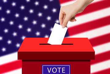 US Elections Concept : Hand holding and putting voting paper in ballot voting box with USA flag in...