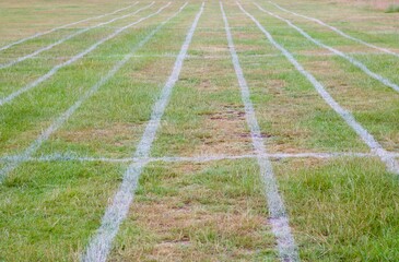 Field marked out with parallel running lanes for athletics events