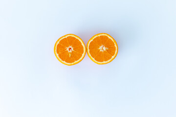 cut oranges are delicious and orange.