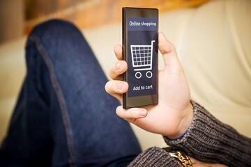 A man is shopping at the online store. Shopping cart icon. Ecommerce.	