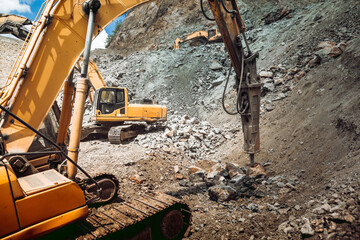 track type excavator and bulldozer working on construction site. Ore quarry and iron ore quarry