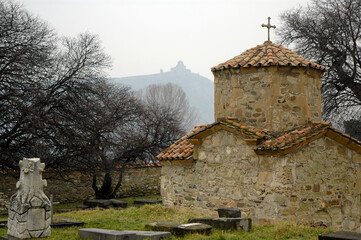 Samtavro cemetery and view at Jvari Monastery. Mtskheta town, Mtskheta-Mtianeti Region, Georgia, Caucasus.