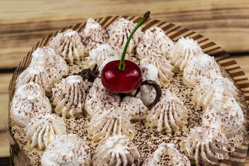 Tiramisu cake decorated with cherry