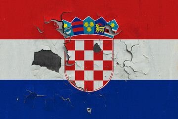 Croatia flag close up old, damaged and dirty on wall peeling off paint to see inside surface....