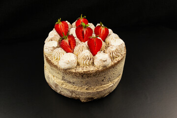 Tiramisu cake decorated with a slice of strawberries