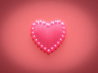 Pink hearts on a pink background.