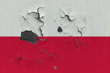 Poland flag close up old, damaged and dirty on wall peeling off paint to see inside surface. Vintage National Concept.